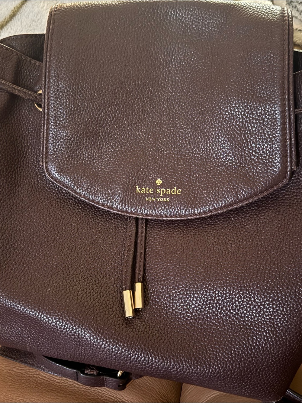 kate spade dark brown pebbled leather backpack with gold hardware